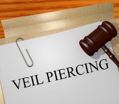 Gavel on legal documents labeled 'veil piercing,' representing Connecticut LLC liability risk