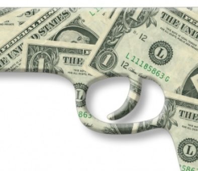 Handgun made of dollar bills, symbolizing high-stakes money in an LLC member standing to sue case