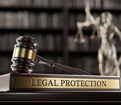 Gavel on a 'Legal Protection' nameplate, representing LLC liability protection